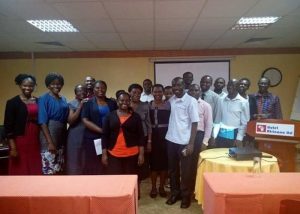 A group photo with the top administration staff of Compassion Uganda after facilitating the training in hospitality management
