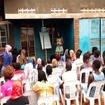 Facilitating a community outreach in Katoogo slum